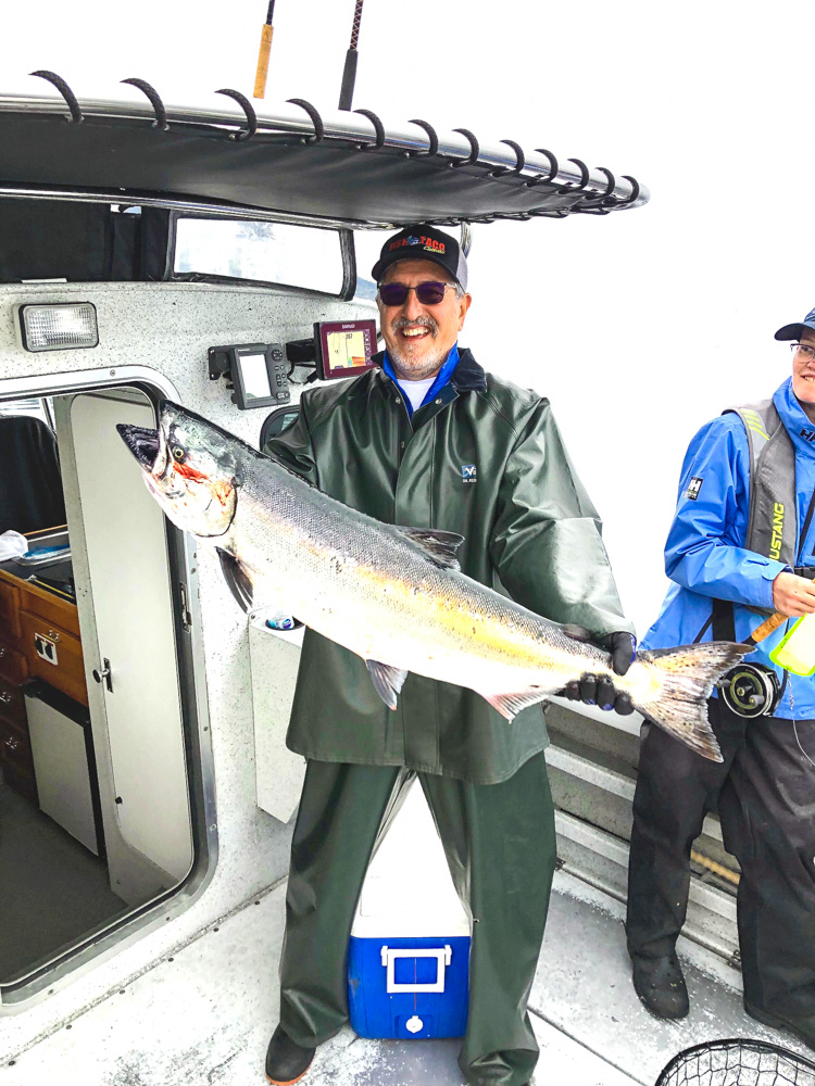 PENN Fishing - Ron Arra, king of the long distance cast, and a nice striper  caught with a Torque spinning reel.